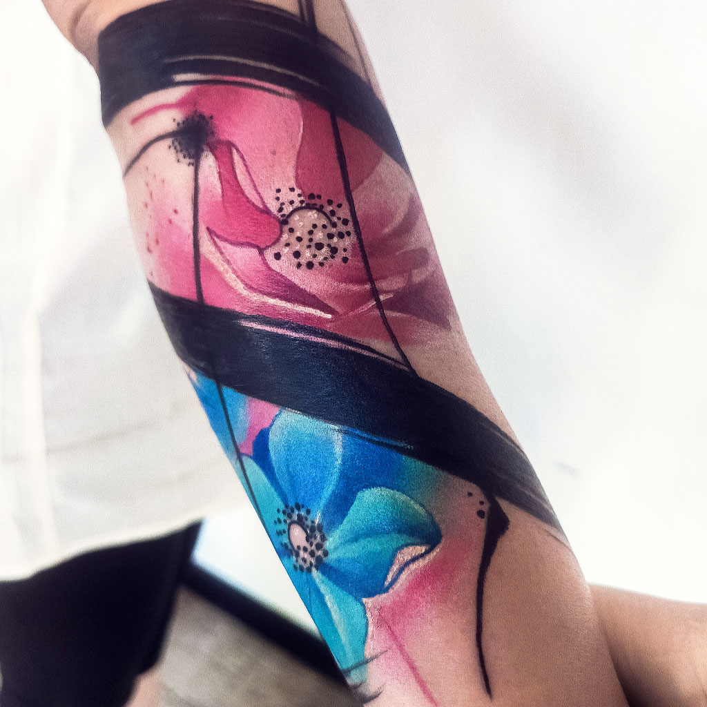 Abstract watercolor anemones tattoo