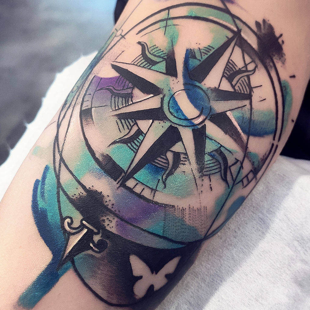 Abstract watercolor compass tattoo