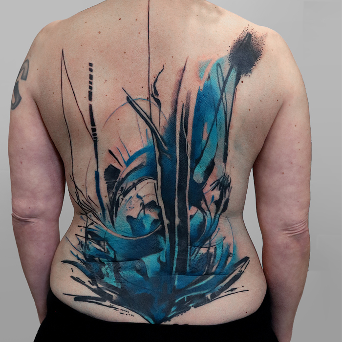 Abstract freehand watercolor back tattoo